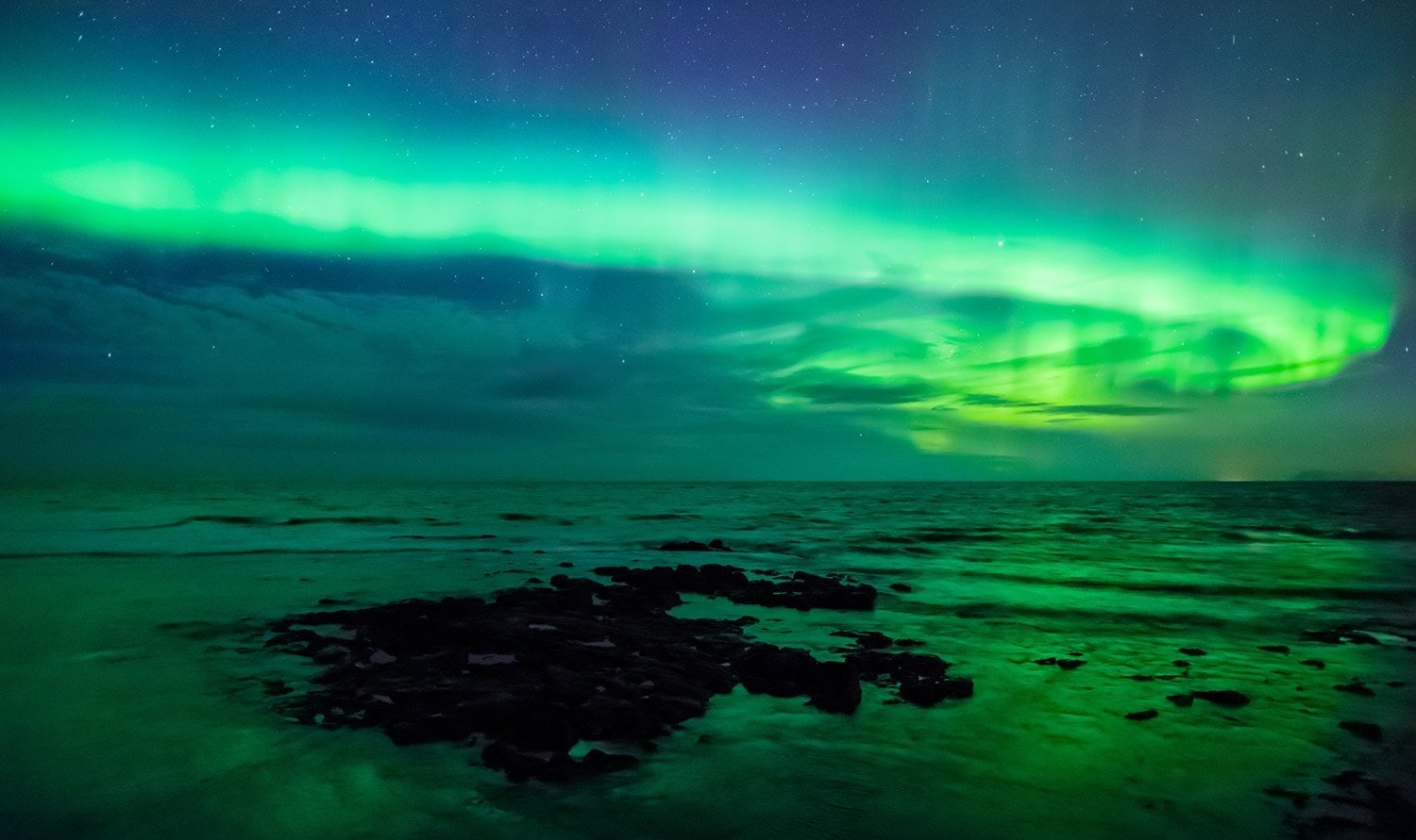 aurora-borealis-over-the-sea-gardur-iceland